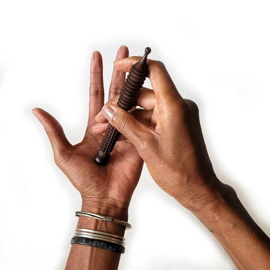 This hand-carved Ayurveda massage stick is a must-have for anyone feeling the strain of long hours on computers or phones. Available at vayuliving.com
