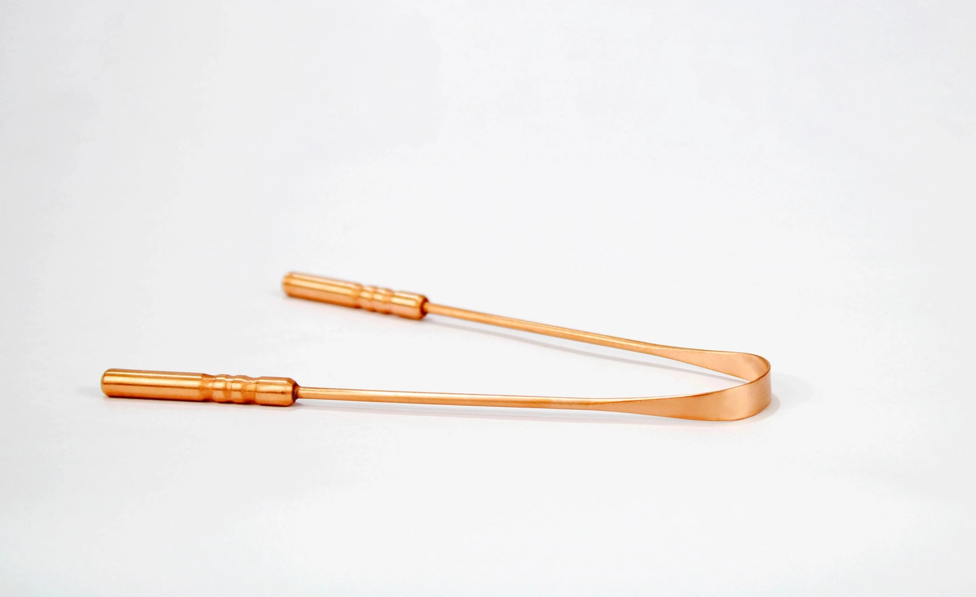 Experience the ancient Ayurvedic practice of tongue scraping with our Copper Tongue Cleaner. Effective at removing food debris and bacteria, this traditional tool offers a natural solution for fresher breath and improved oral hygiene. Available at Vayu Living.