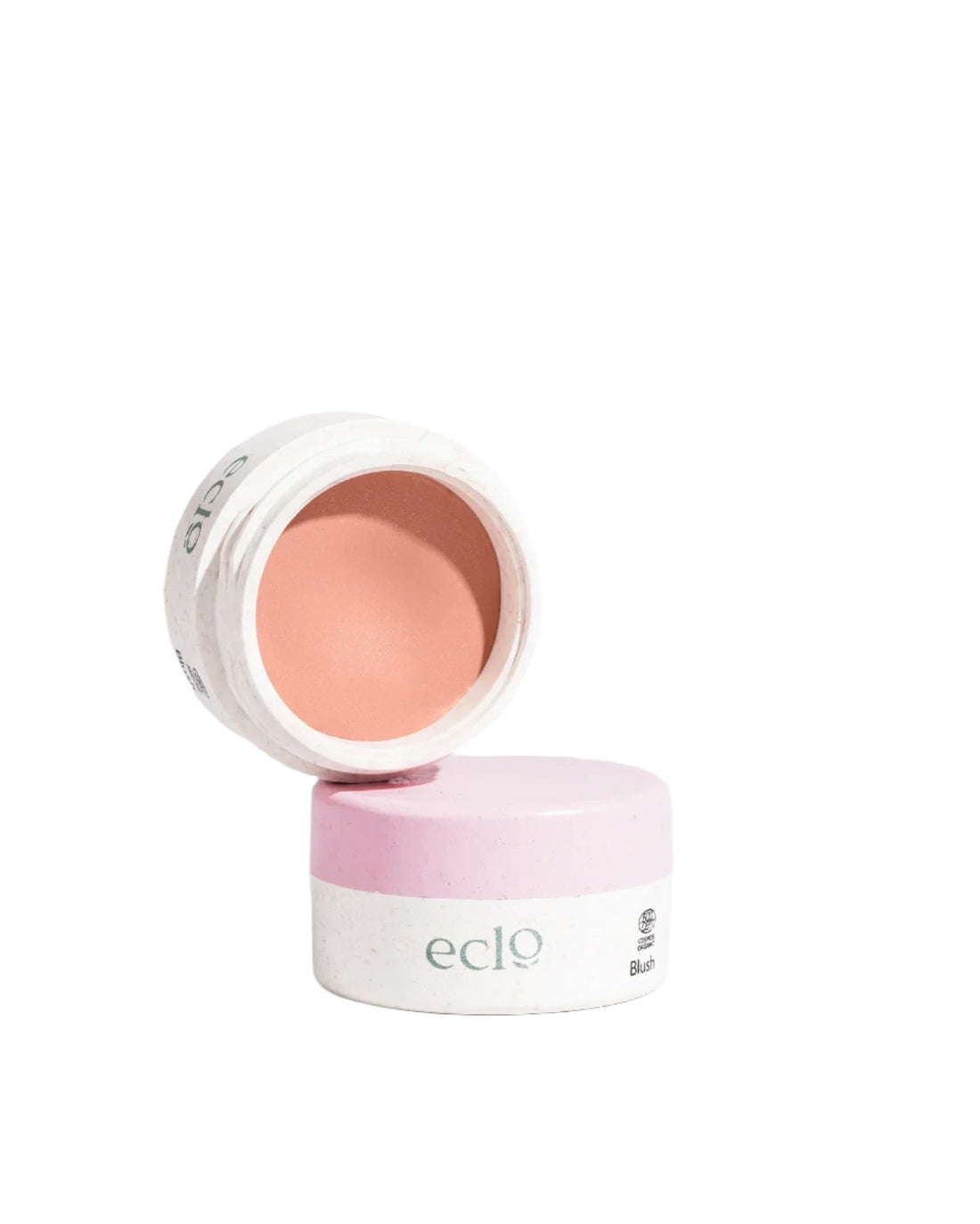 Eclo Blush Pêche Sunset offers a luxurious, semi-solid formula crafted with vegetable wax for a smooth, sensory application. Infused with mineral pigments, this blush melts effortlessly into your skin, delivering a natural, radiant glow. Available at wwwvayuliving.com