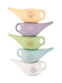 Experience the beauty and functionality of this cute glazed ceramic Neti pot, adorned with a mandala design. Available at Vayu Living.