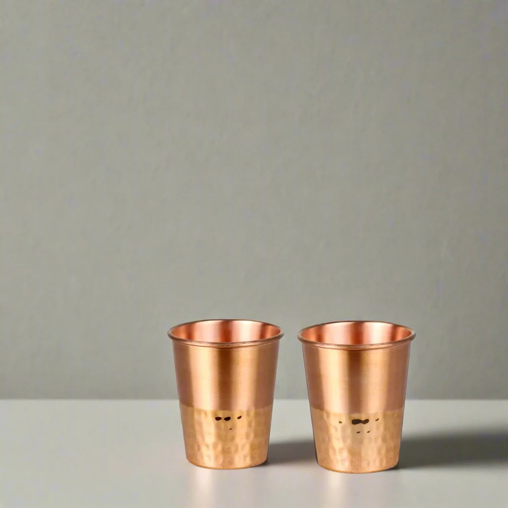 Upgrade your hydration routine with this beautifully crafted set of 2 copper cups. Available at vayuliving.com