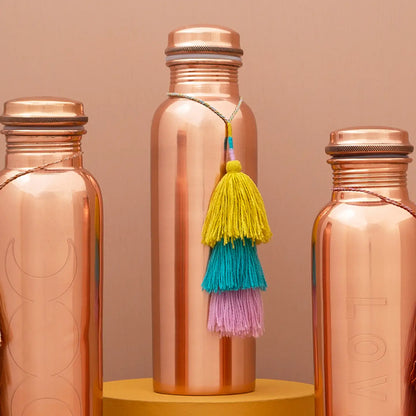 Add a vibrant touch to your copper bottle or bag with this playful and cute tassel! Available at vayuliving.com