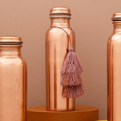 Add a vibrant touch to your copper bottle or bag with this playful and cute tassel! Available at vayuliving.com