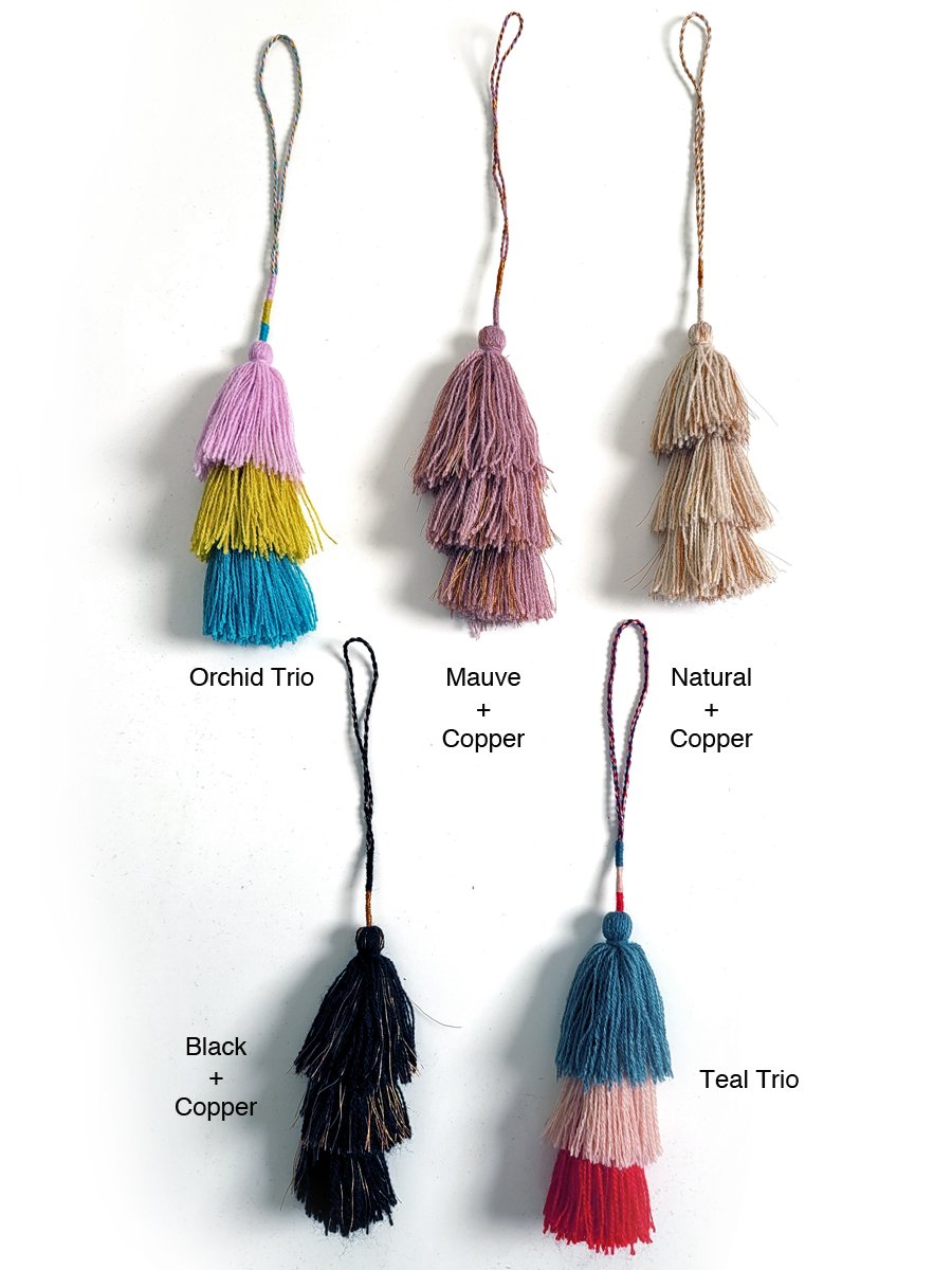 Add a vibrant touch to your copper bottle or bag with this playful and cute tassel! Available at vayuliving.com