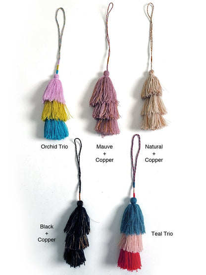 Add a vibrant touch to your copper bottle or bag with this playful and cute tassel! Available at vayuliving.com