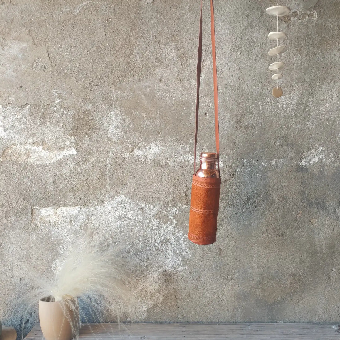  Beautifully crafted, hand-embroidered water bottle carrier. Available at vayuliving.com