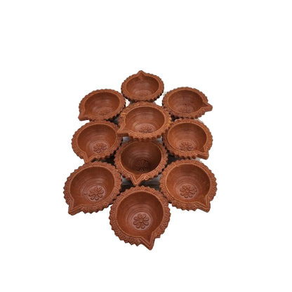Illuminate your space with our Clay Diyas, a symbol of tradition and warmth.  Made from natural clay, these elegant Diyas provide a serene glow, perfect for festive celebrations or everyday ambiance. Available at Vayu Living.
