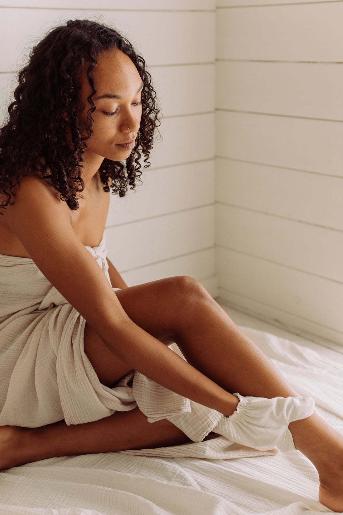 Introducing the Garshana Gloves: Your Daily Ritual for Radiant Skin and Revitalized Well-Being.  Crafted from raw silk, these gloves offer a traditional Ayurvedic dry massage that stimulates lymphatic flow, boosts circulation, and combats cellulite. Available at Vayu Living.